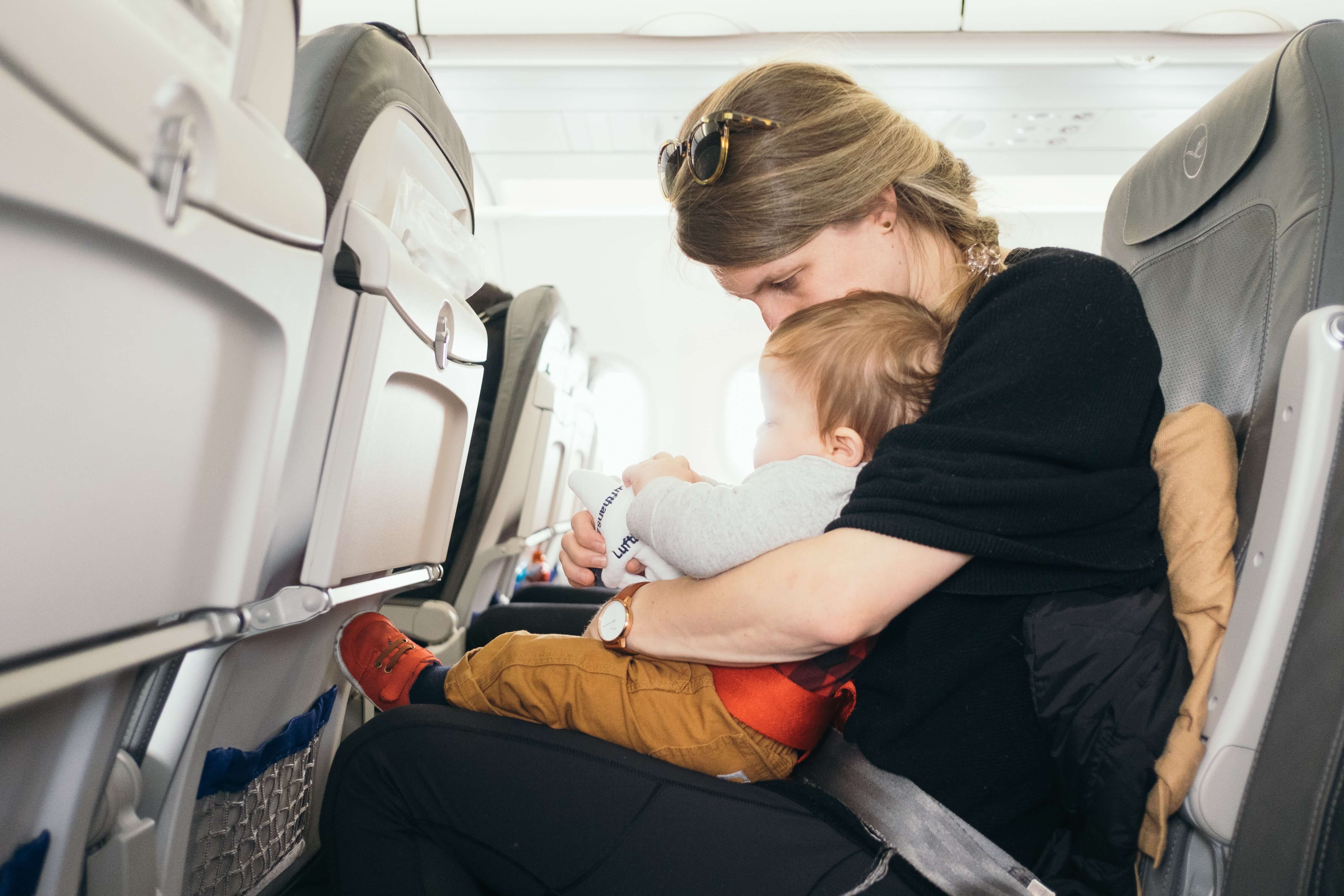 mom with kid on a plane