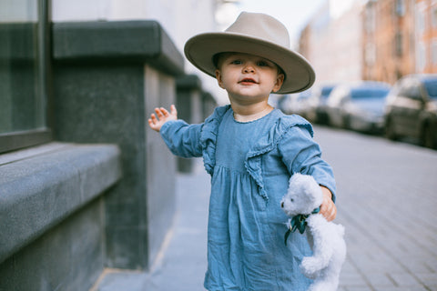 Toddler in hat protecting from the sun