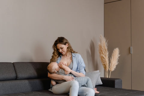 Woman breastfeeding her baby at the office