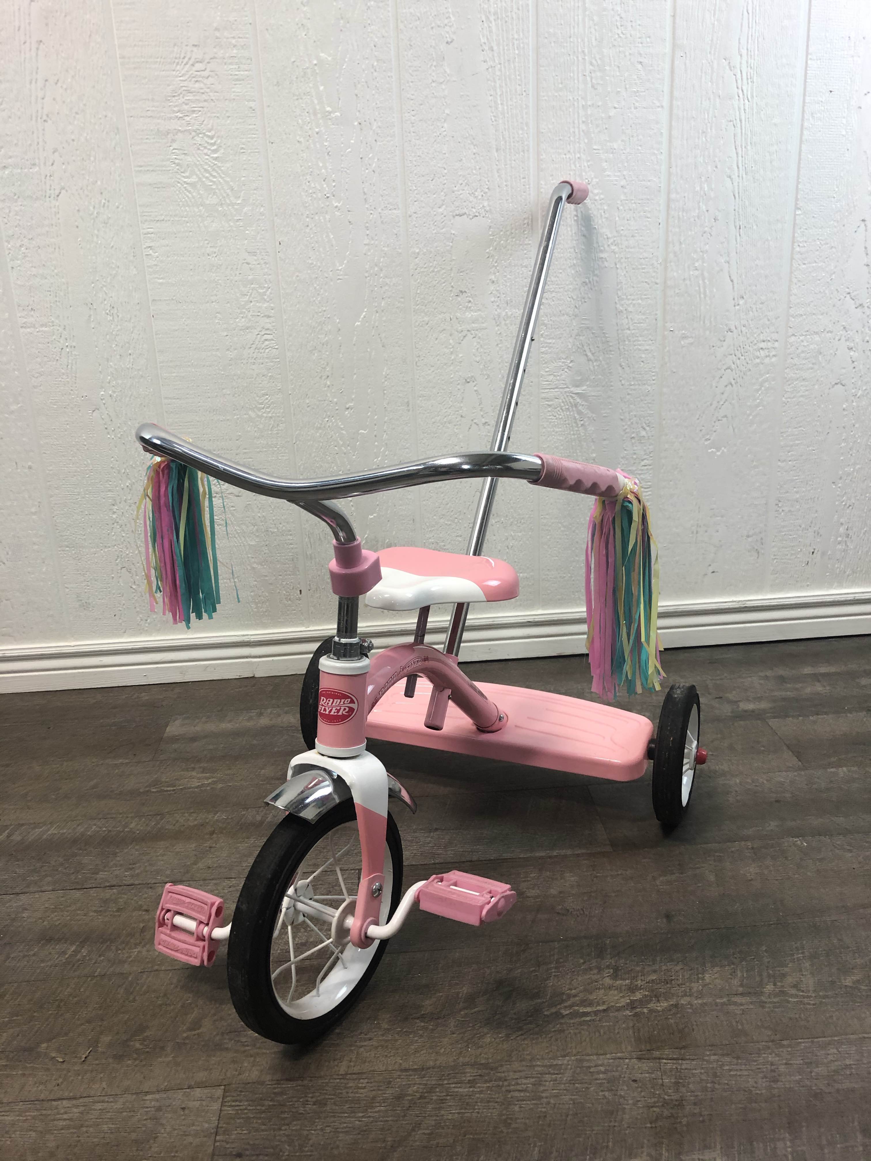 classic red tricycle with push handle