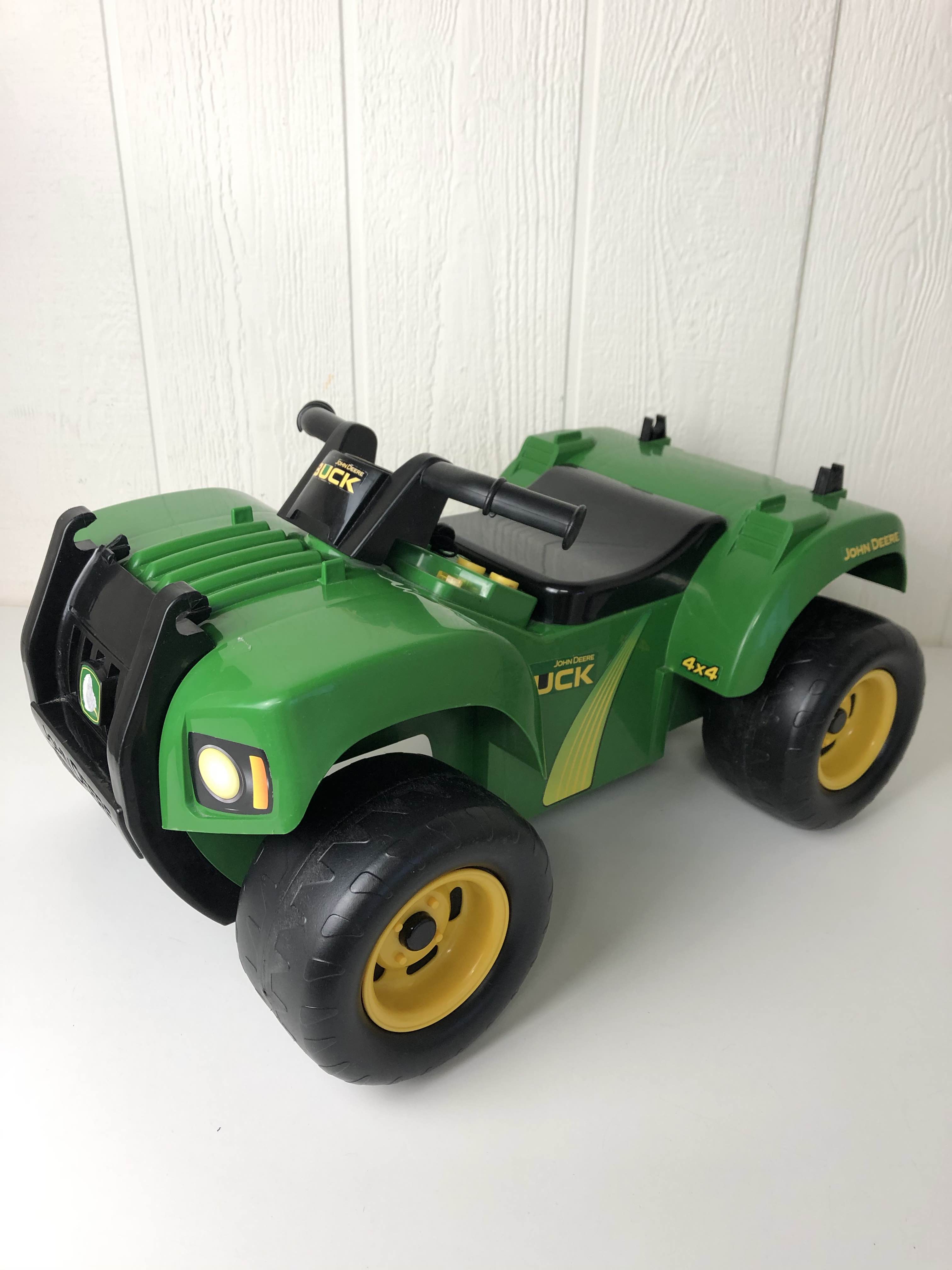 john deere buck ride on toy