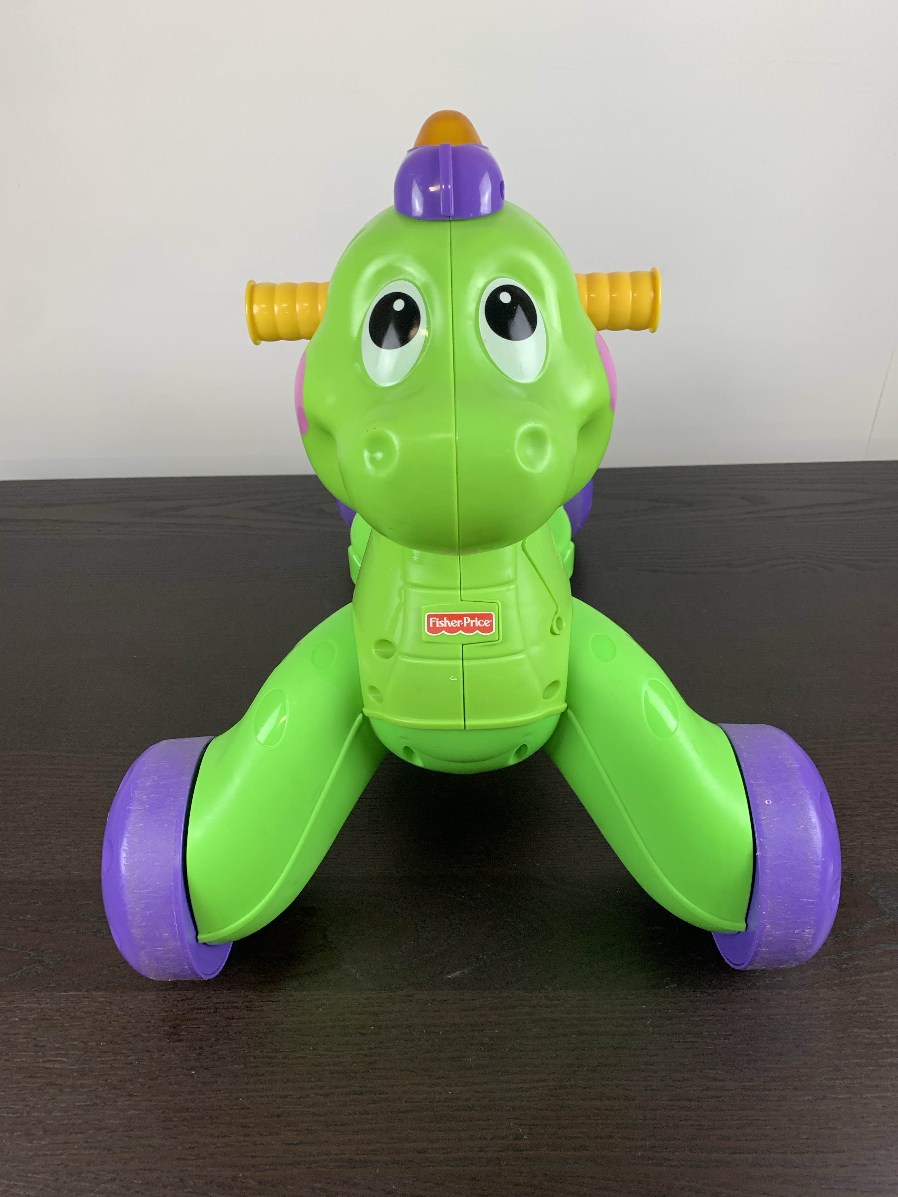 fisher price stride to ride dino