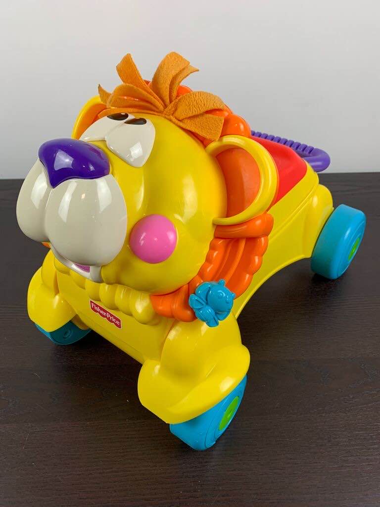 stride and ride lion fisher price