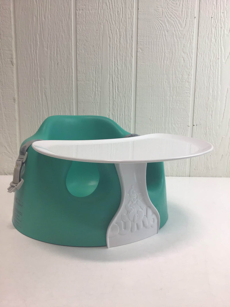 green bumbo seat with tray