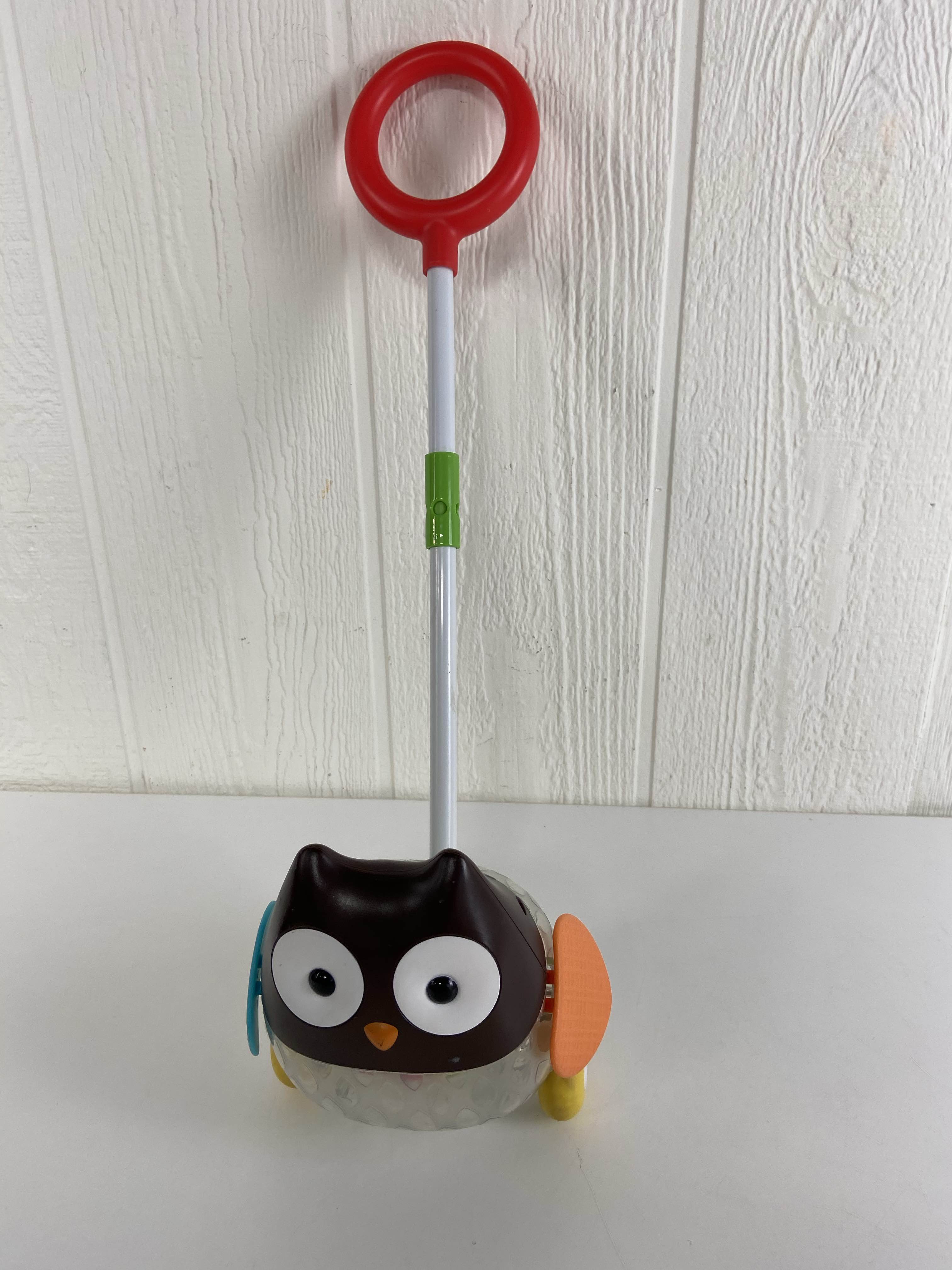 skip hop explore and more rolling owl push toy