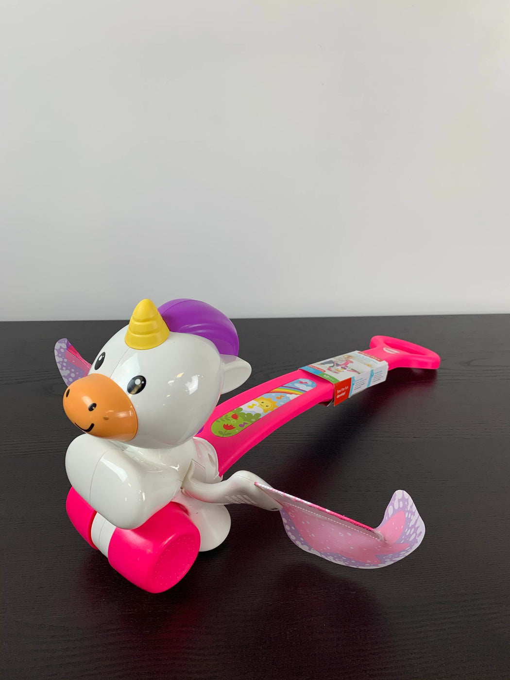 fisher price push and flutter unicorn