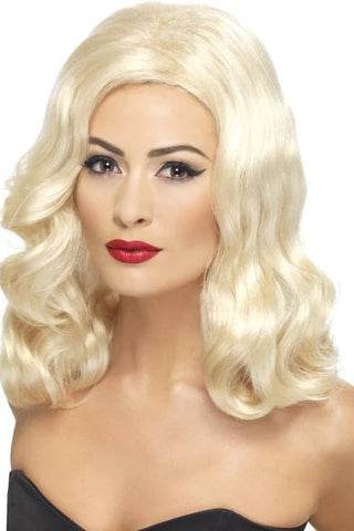 Woman wearing a long blond 20s style wig