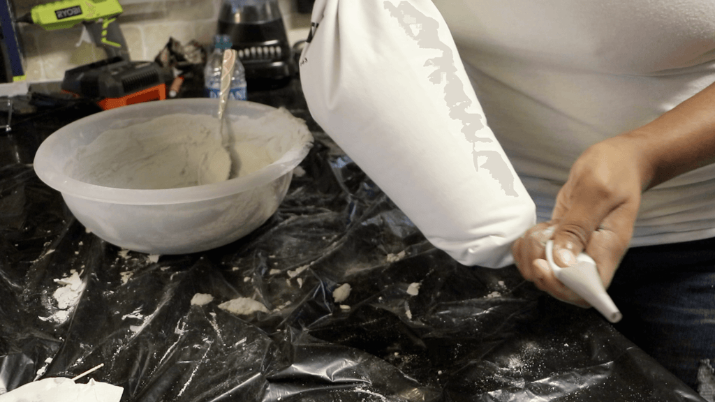 Pouring grout into a grout bag