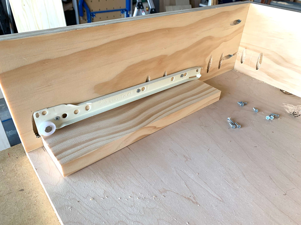 Drawer Slide being installed on a vanity desk top