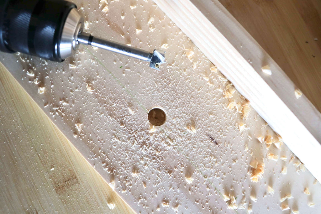 Forstner Bit and hole drilled in select pine board