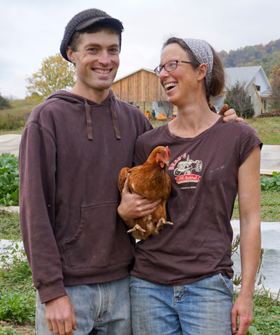 Ben Stowe and Heather Coiner with chicken at Little Hat Creek Farm