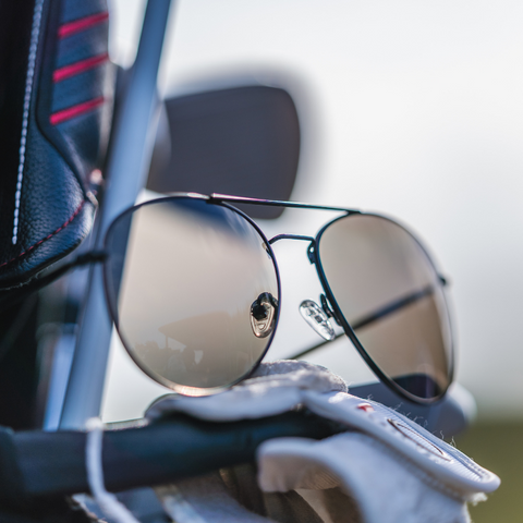 Aviator sunglasses on a golf cart
