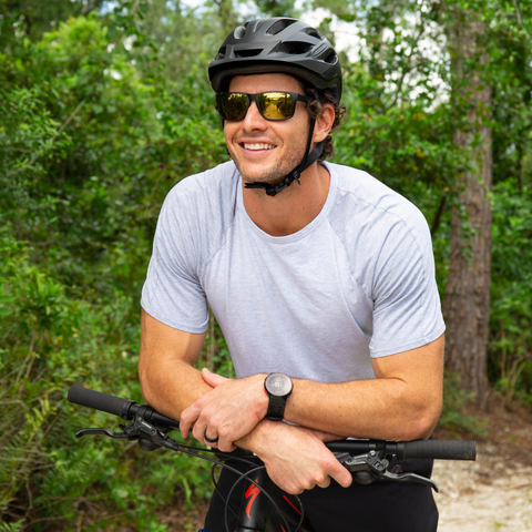 Man wearing sunglasses while sitting on Mountain Bike