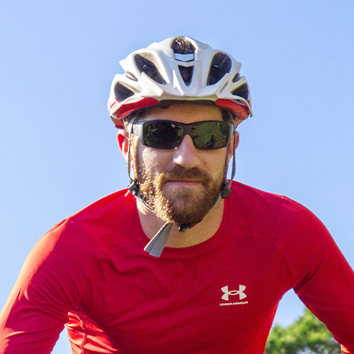 Man wearing AMP sunglasses out biking
