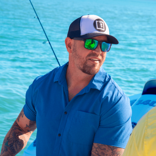 Man wearing AMP sunglasses offshore fishing