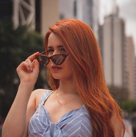 Red Head with Fashionable Cat Eye Sunglasses