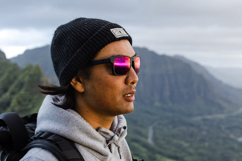 man wearing sunglasses outdoors hiking