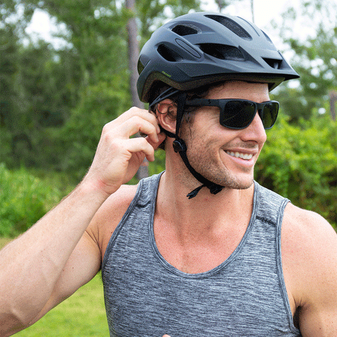 man wearing helmet and sunglasses outdoors