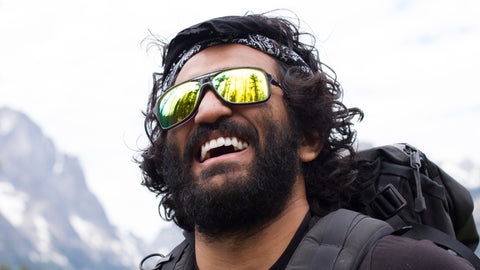 Man smiling while hiking wearing sunglasses with Fuse lenses