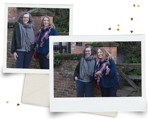 Polaroid pictures of models in front of a brick wall in jumpers and large scarves