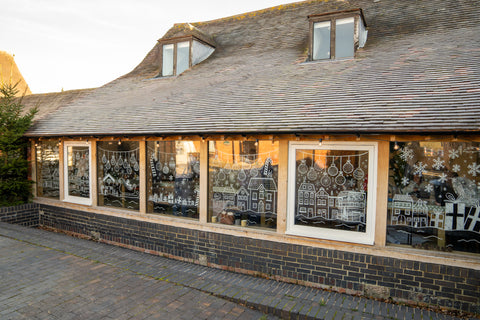 Christmas chalk drawn windows at The Makers' Space