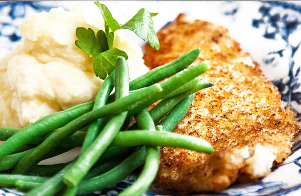 Image of breaded sprat with mashed potatoes on a beautiful plate