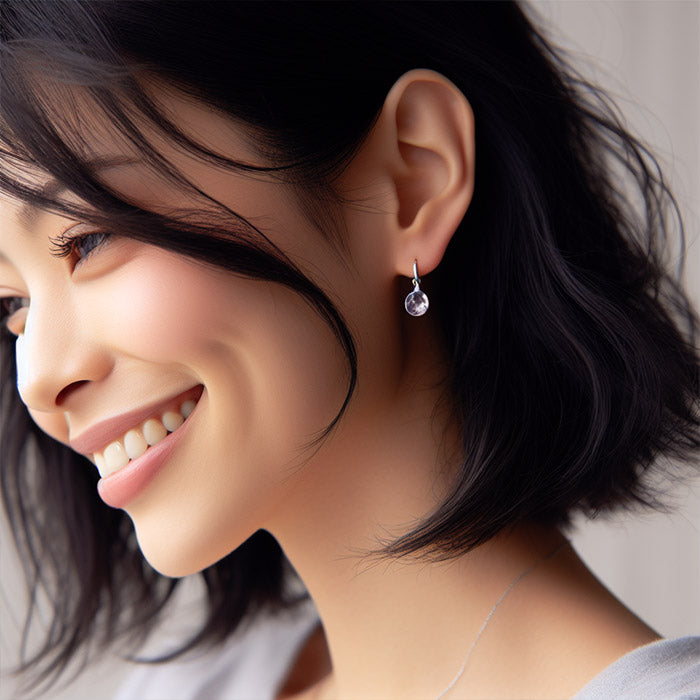 amethyst earrings sterling silver oval shape worn by woman