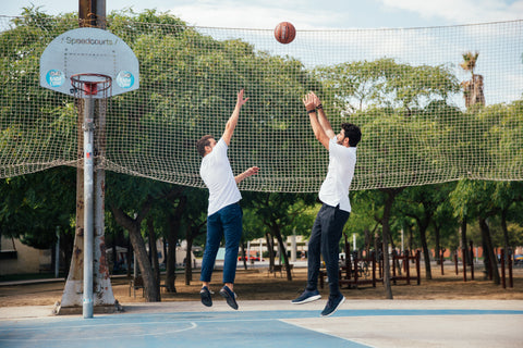 Men playing basketball