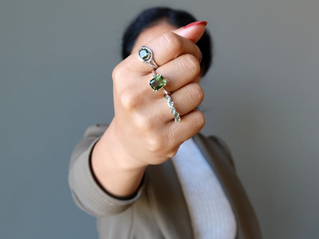 sheila of satin crystals wearing three moldavite rings