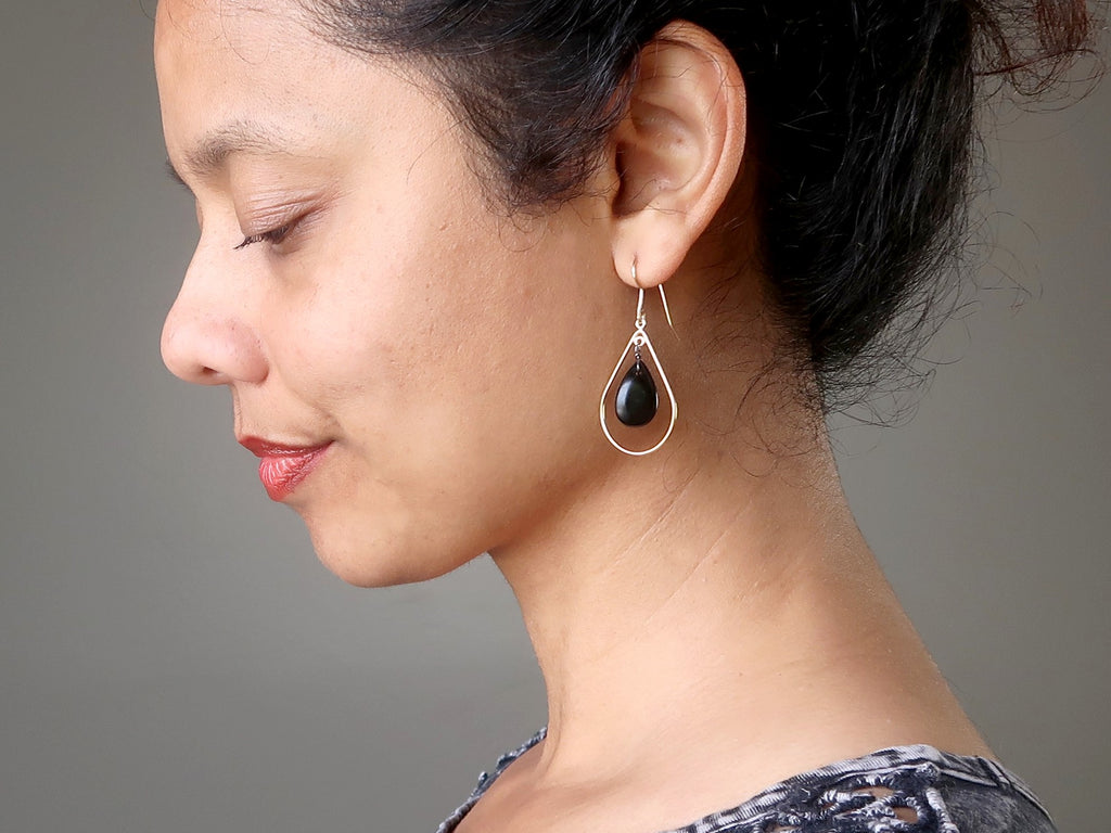 woman modeling jet stone dangle earrings