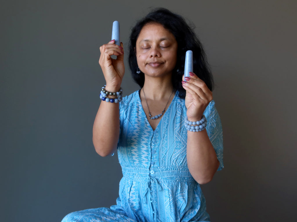 sheila of satin crystals meditating with blue angelite wands