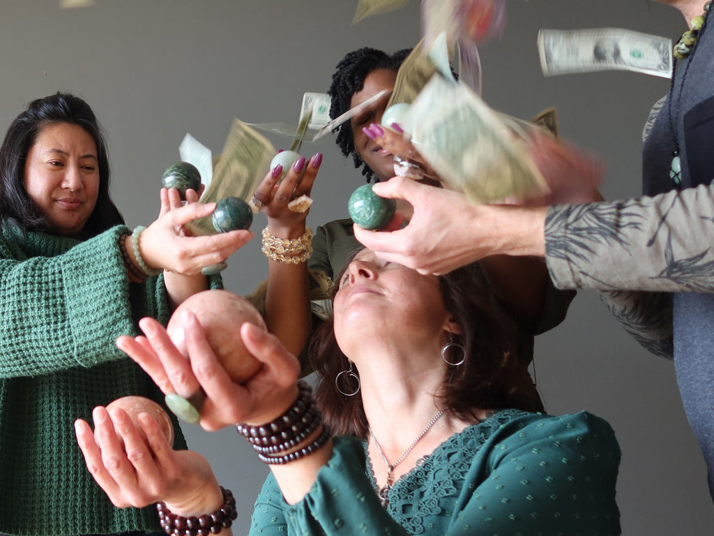 money raining on people holding aventurine spheres