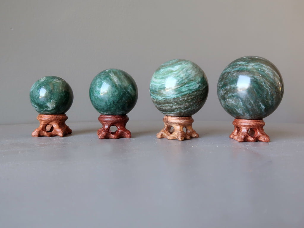 four green aventurine spheres