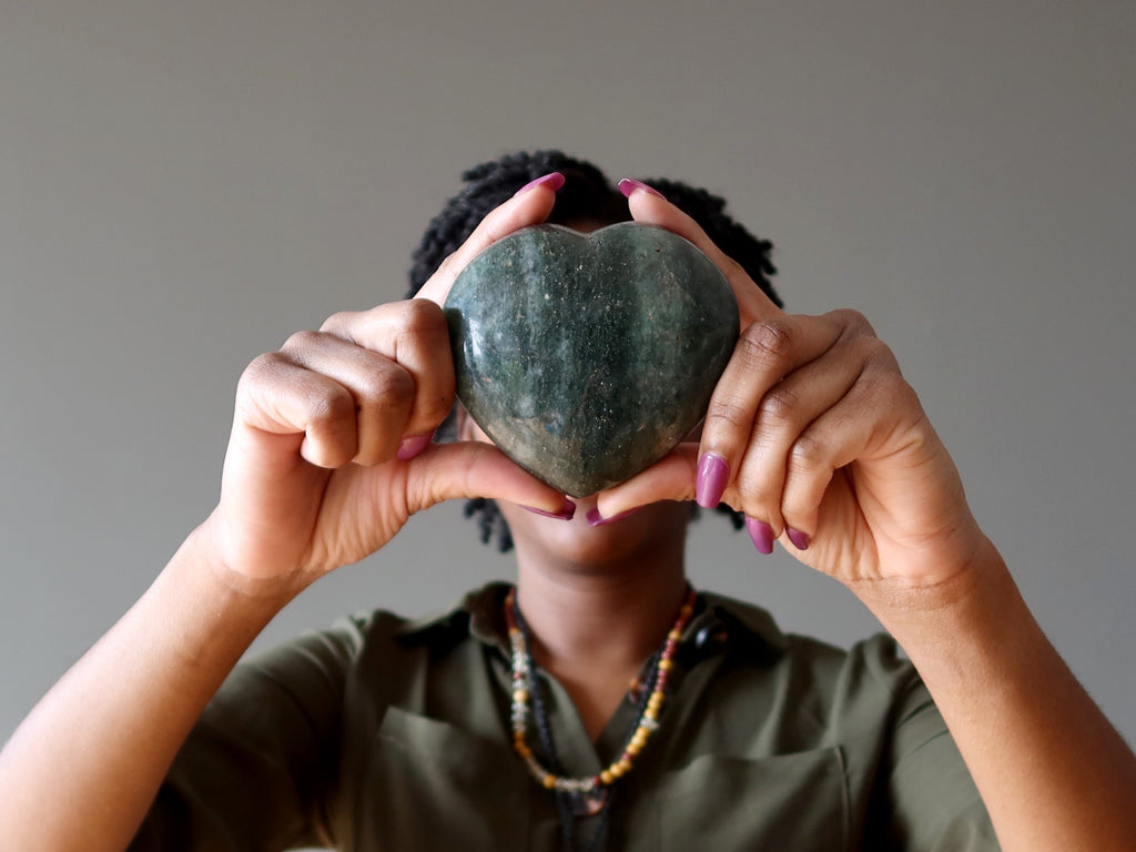 lady holding green aventurine heart