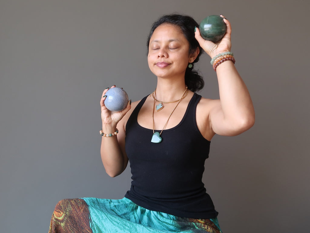 sheila of satin crystals meditating with blue and green aventurine balls