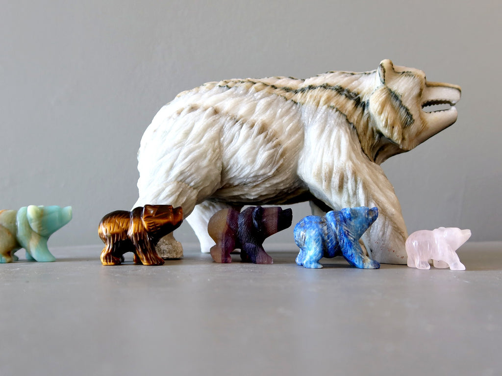 gemstone bear figurines marching in a line