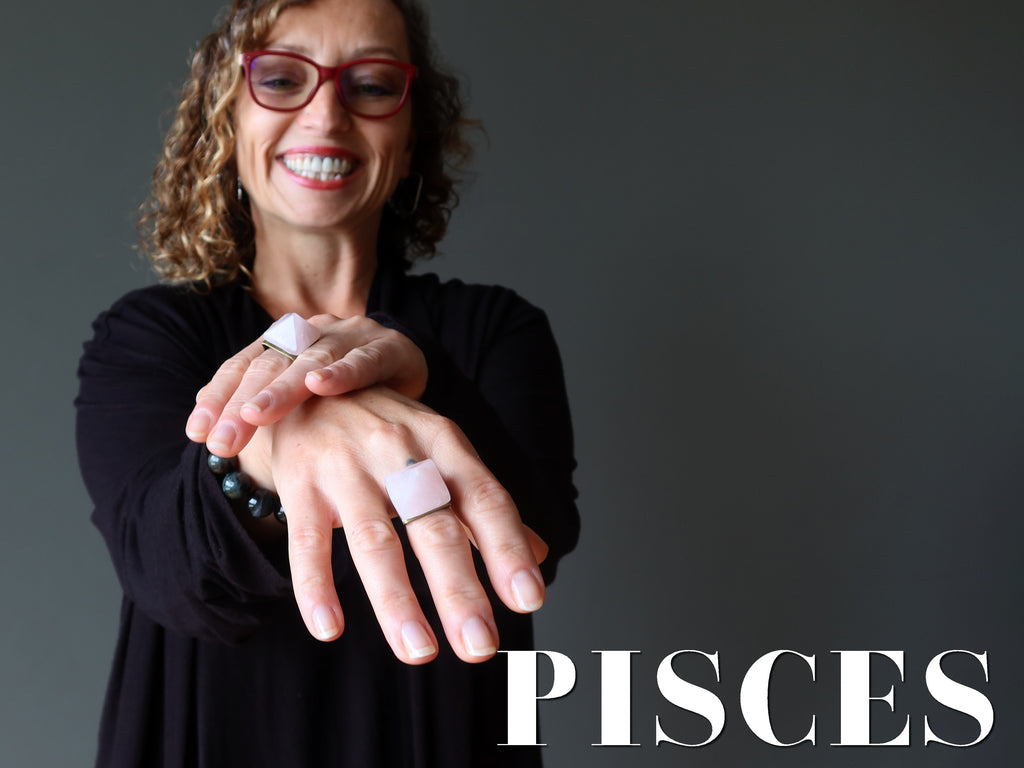 woman wearing rose quartz rings