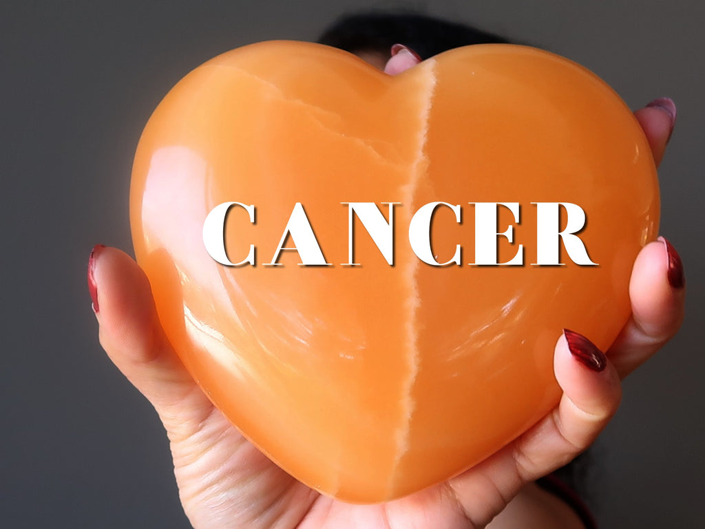 orange calcite heart with word CANCER