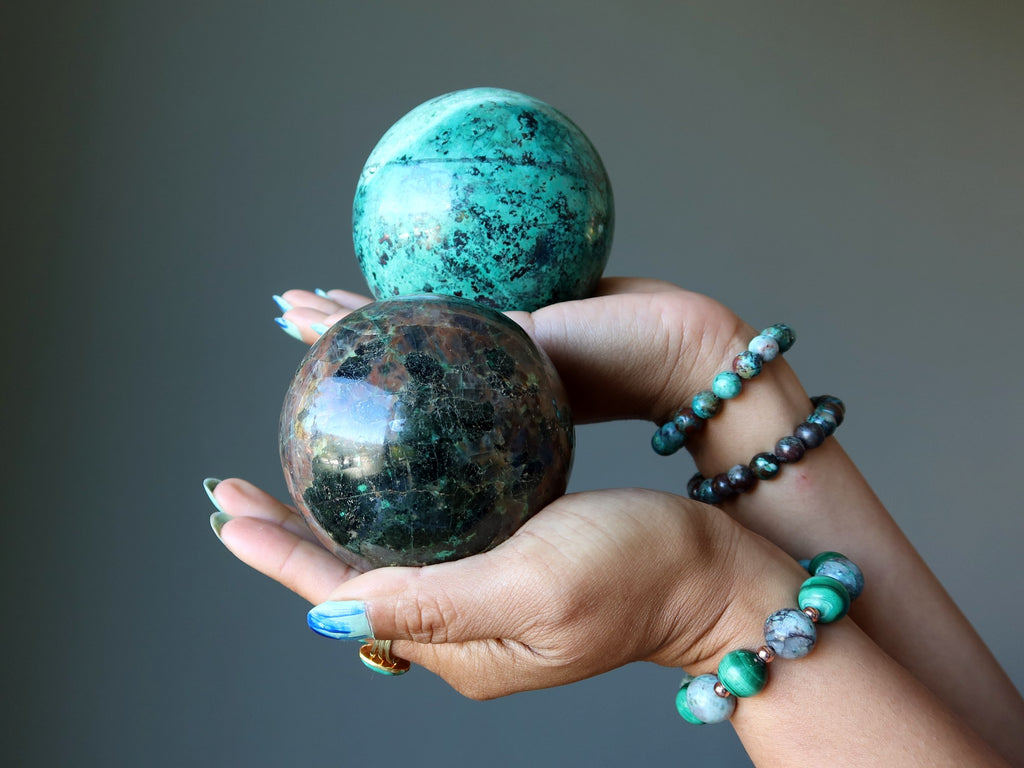 chalcocite and chrysocolla spheres in hands