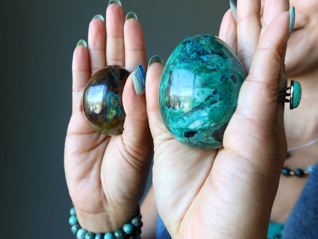 chrysocolla eggs in palms of hands