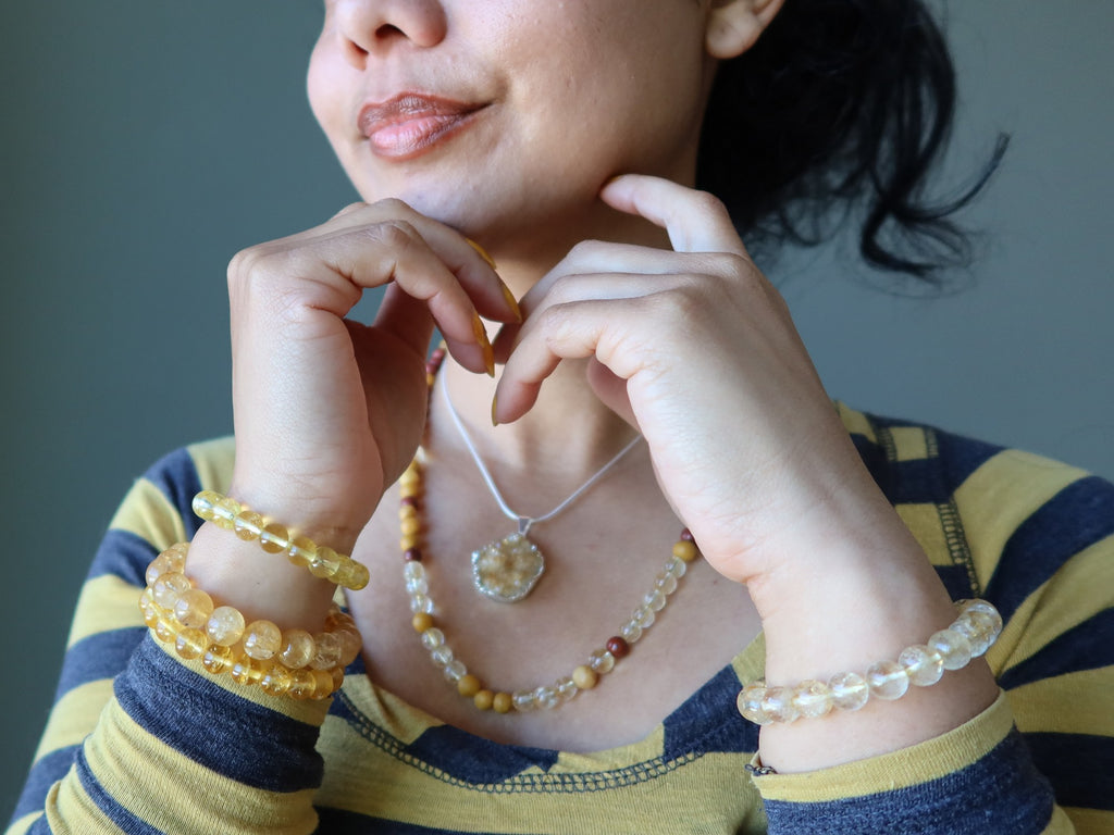 female wearing citrine jewelry