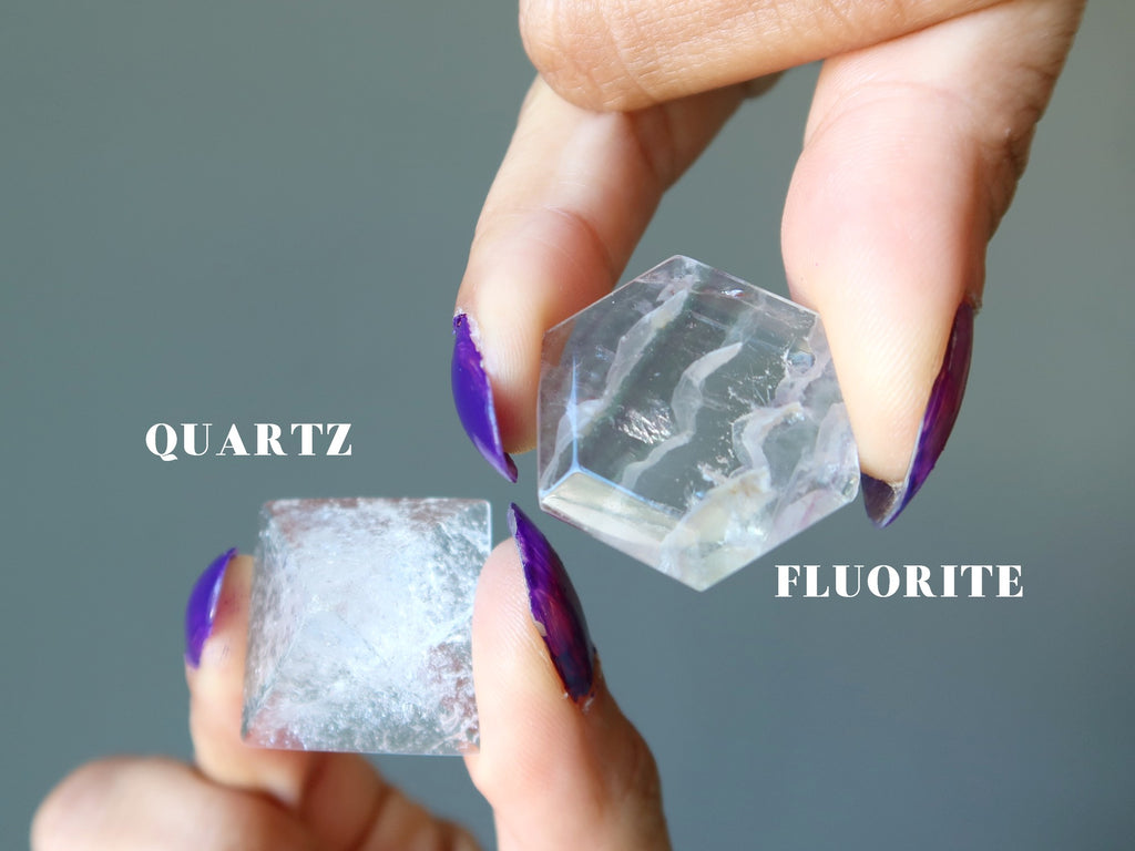hand holding clear quartz and fluorite hexagon
