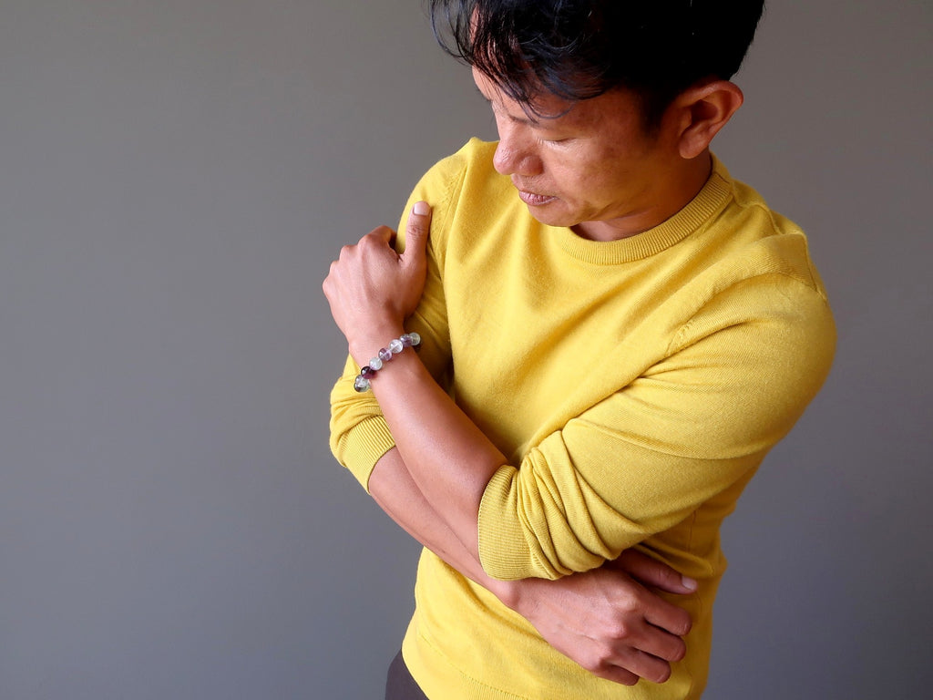 man wearing fluorite bracelet