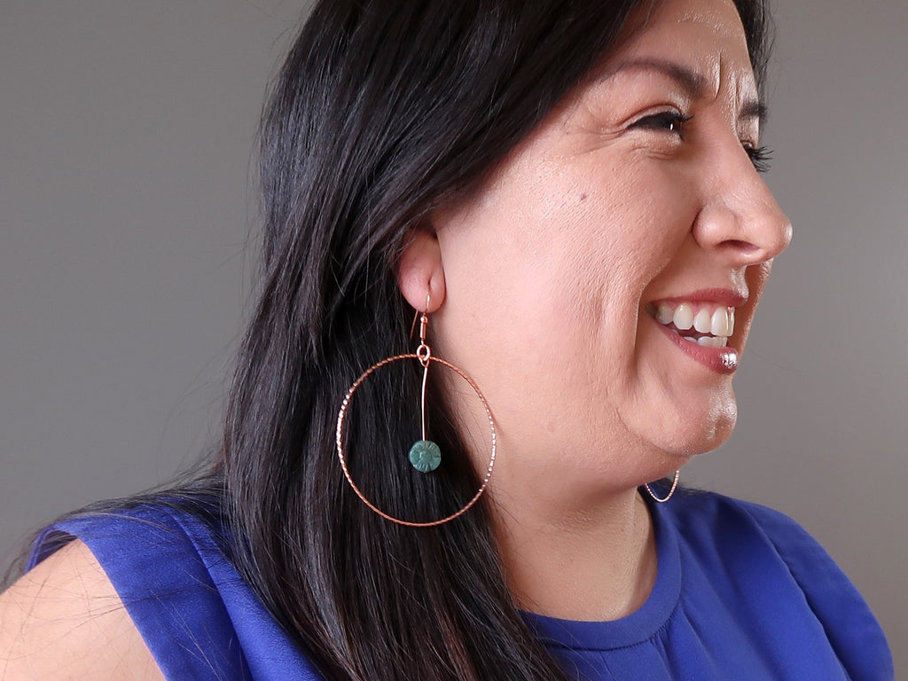 valerie of satin crystals wearing green moss agate flower copper hoop earrings