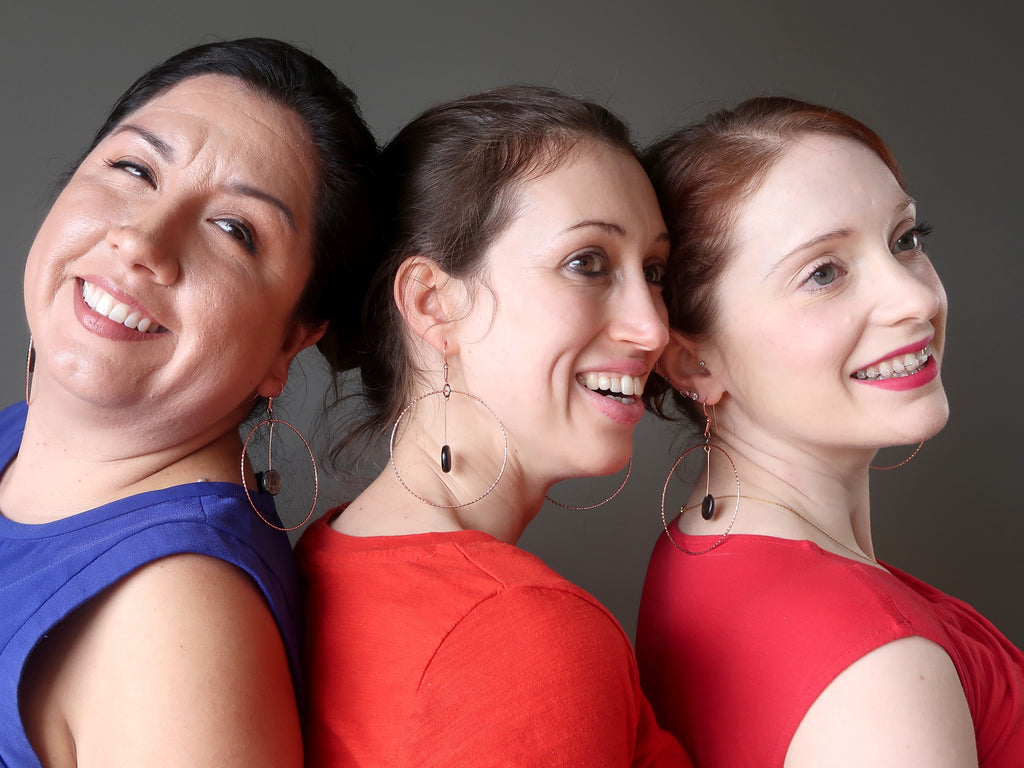 valerie, holly and gemma of satin crystals wearing big mica hoop earrings