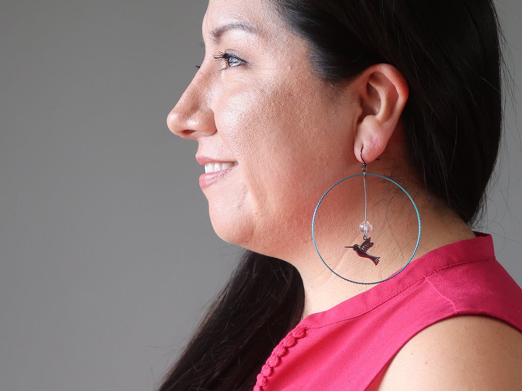 valerie of satin crystals wearing large hummingbird quartz stone hoop earrings