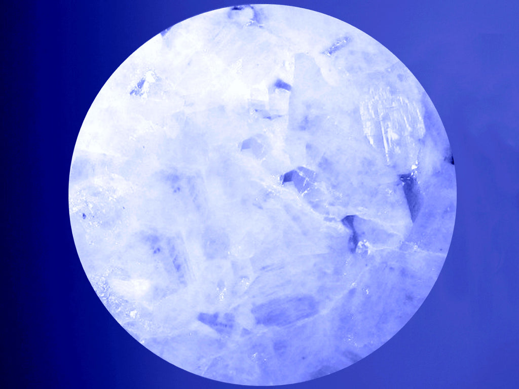 rainbow moonstone sphere on blue background