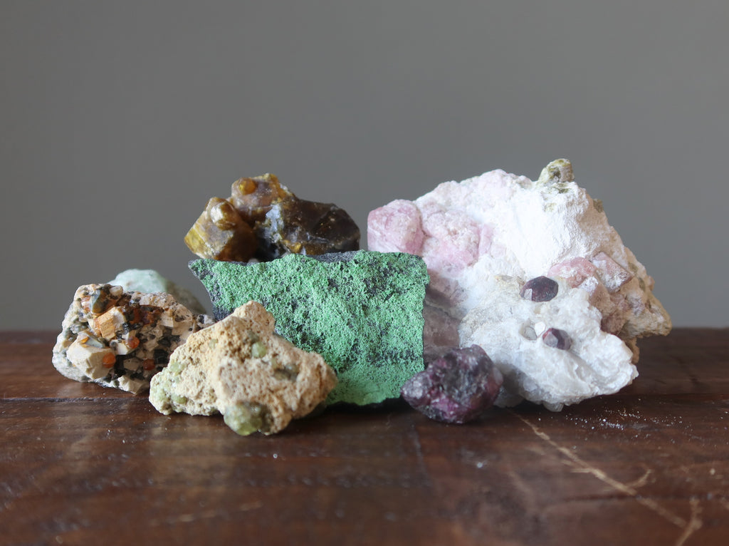 a display of natural garnet stones in different variations