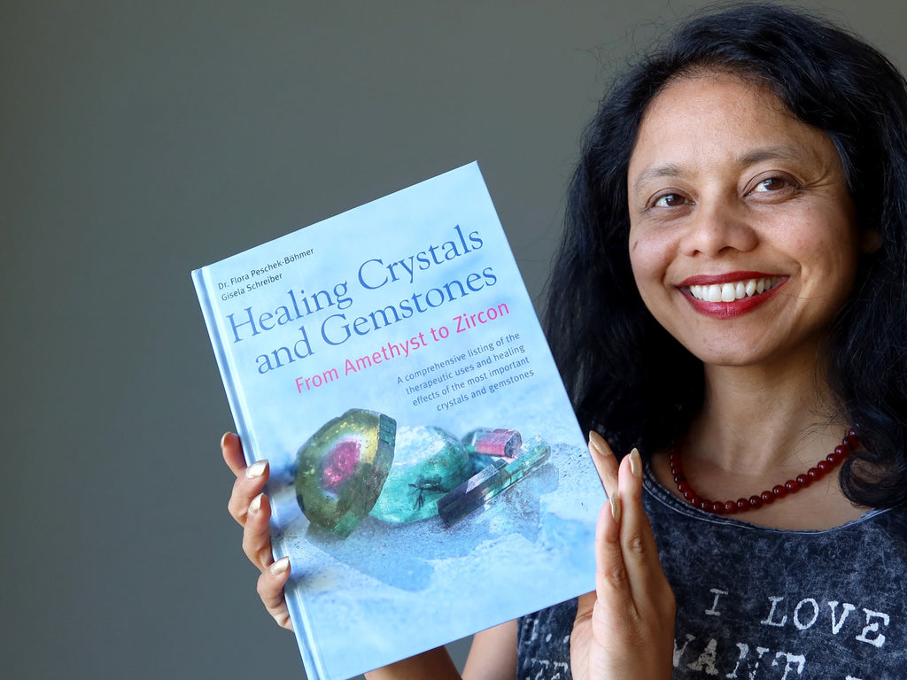 sheila of satin crystals holding a healing crystals book