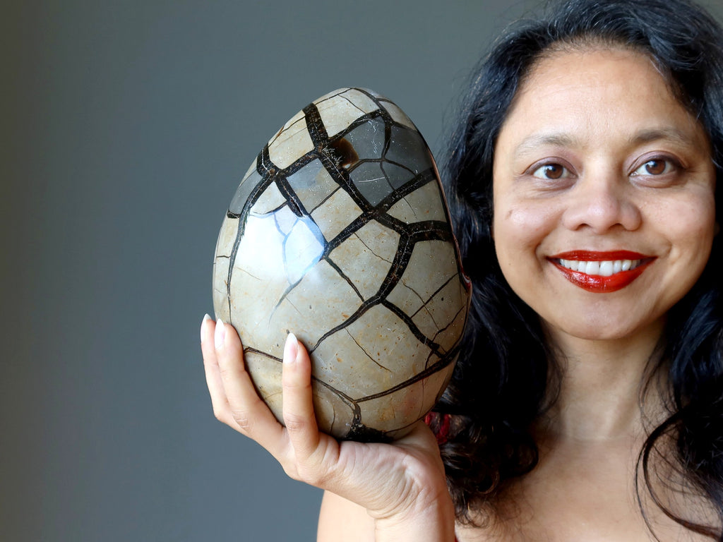 Happy Easter from Satin Crystals holding a large septarian stone egg